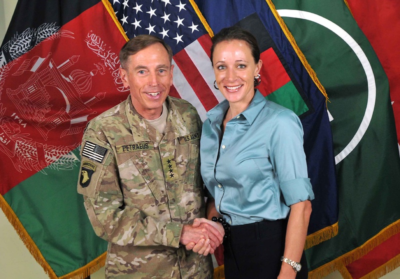 This July 13, 2011, photo made available on the International Security Assistance Force's Flickr website shows the former Commander of International Security Assistance Force and U.S. Forces-Afghanistan Gen. Davis Petraeus, left, shaking hands with Paula Broadwell, co-author of "All In: The Education of General David Petraeus." The two allegedly had an affair, which led to Gen. Petraeus' resignation as director of the Central Intelligence Agency. (AP Photo/ISAF)