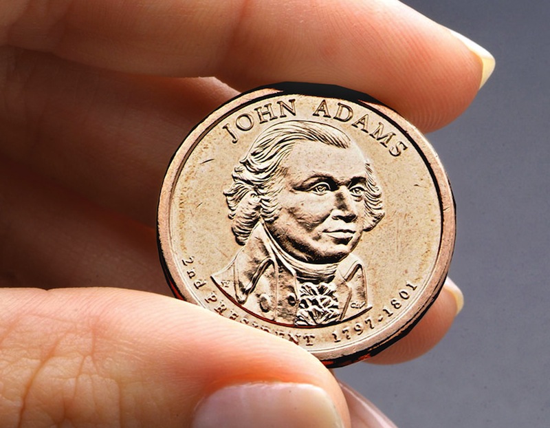 This undated file photo provided by the U.S. Mint shows the President John Adams presidential $1 coin. Congressional auditors say doing away with dollar bills entirely and replacing them with dollar coins could save taxpayers some $4.4 billion over the next 30 years. (AP Photo/US Mint, File)