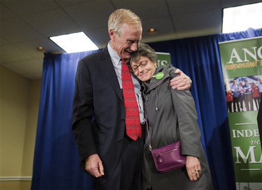 Independent Senator-elect Angus King hugs his wife, Mary Herman, after he spoke at a news conference, Wednesday, Nov. 7, 2012, in Freeport, Maine.