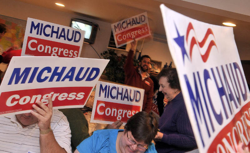 Staff photo by Michael G. Seamans Mike Michaud supporters cheer in East Millinocket on Tuesday.