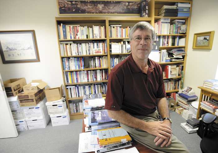 Anthony Corrado, a well-known expert on the subject of campaign finance, in his office at Colby College in Waterville on July 24.