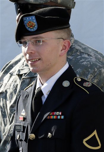 Army Pfc. Bradley Manning is escorted out of a courthouse in Fort Meade, Md., after a pretrial hearing on June 25, 2012.