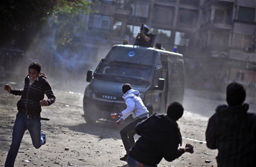 Egyptian protesters clash with security forces near Tahrir Square in Cairo on Wednesday.