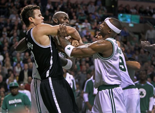 Boston Celtics' Kevin Garnett, center, Rajon Rondo, front right and Jason Terry (partially obscured, back right, confront Brooklyn Nets' Kris Humphries, front left, during an NBA game in Boston, Wednesday, Nov. 28, 2012. (AP Photo/The Globe/Jim Davis) NO SALES; MAGAZINES OUT; INTERNET OUT; BOSTON HERALD OUT; QUINCY OUT