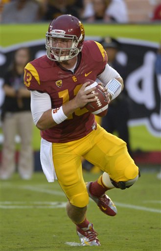 In this photo taken, Oct. 20, 2012, Southern California quarterback Max Wittek rolls out to pass during the second half of an NCAA college football game against Colorado in Los Angeles. The freshman is replacing Matt Barkley, an injured senior who has claimed most of the career passing records at USC, when they host No. 1 Notre Dame on Saturday. (AP Photo/Mark J. Terrill)