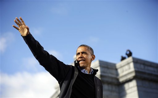 President Barack Obama waves to supporters during a campaign event at Capitol Square on Sunday in Concord, N.H.