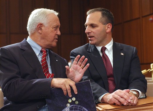 This Oct. 8, 2002, photo shows former New Hampshire Sen. Warren Rudman, left, talking with former FBI Director Louis Freeh on Capitol Hill in Washington.