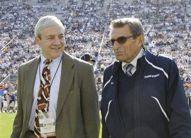 In this Oct. 8, 2011, photo then-Penn State President Graham Spanier, left, and head football coach Joe Paterno talk before a football game against Iowa in State College, Pa.