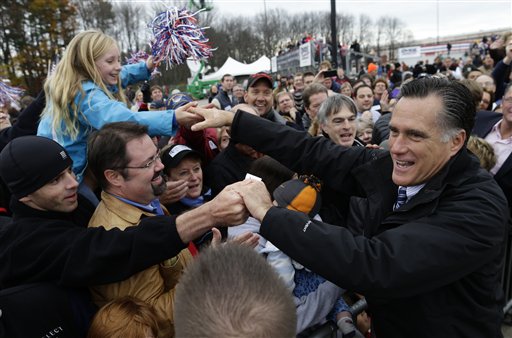 Republican presidential candidate Mitt Romney greets supporters as he campaigns at Portsmouth International Airport, in Newington, N.H., on Saturday.