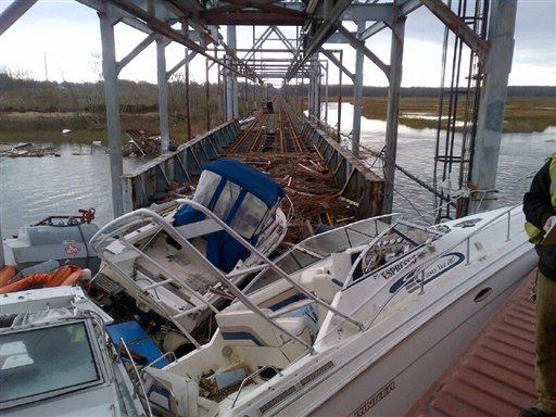 This undated photo made available by New Jersey Transit shows boats and other debris on New Jersey Transit's Morgan draw bridge in the aftermath of superstorm Sandy, in South Amboy, N.J.