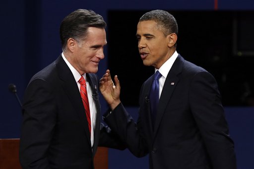 Republican presidential candidate Mitt Romney and President Barack Obama talk after the first presidential debate at the University of Denver in Denver in this Oct. 3, 2012, photo.