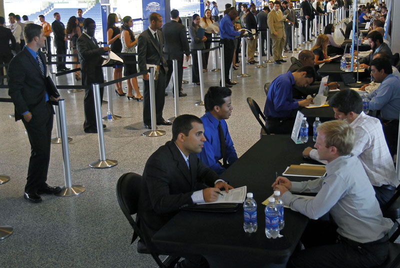 Job applicants are interviewed by Florida Marlins staff at Marlins Park in Miami.