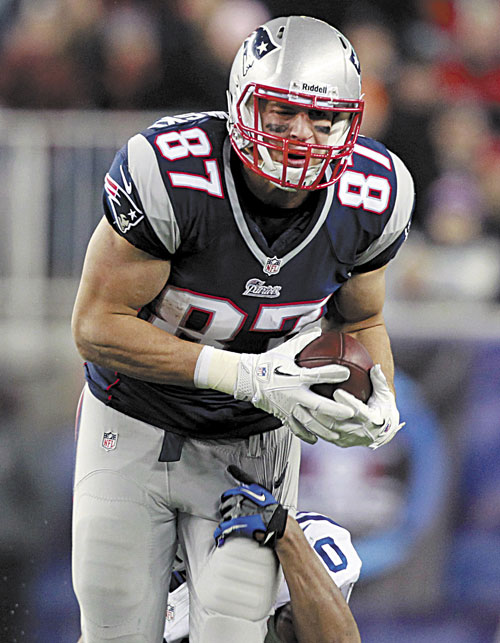OUT OF ACTION: New England tight end Rob Gronkowski left Sunday’s game against Indianapolis after breaking his left forearm while blocking on an extra point late in the Patriots’ 59-24 win.