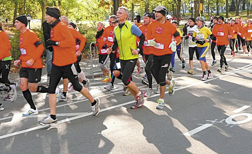 GOING ANYWAY: Runners who were planning to run in the New York City Marathon run through Central Park in Manhattan in an alternative marathon Sunday in New York. The official race was canceled Friday because of Superstorm Sandy.
