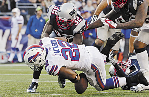 JUST ENOUGH: New England cornerback Devin McCourty (32) came up with two big plays against Buffalo on Sunday in Foxborough, Mass. McCourty first forced Bills running back Fred Jackson (22) to fumble and then had a game-ending interception in the end zone.