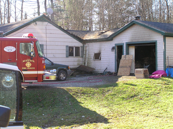 The scene of a Saturday morning fire that damaged a home at 816 Civic Center Drive in Augusta. Two people were injured and a dog was killed in the blaze, according to Augusta Fire Department Battalion Chief Dave Groder.