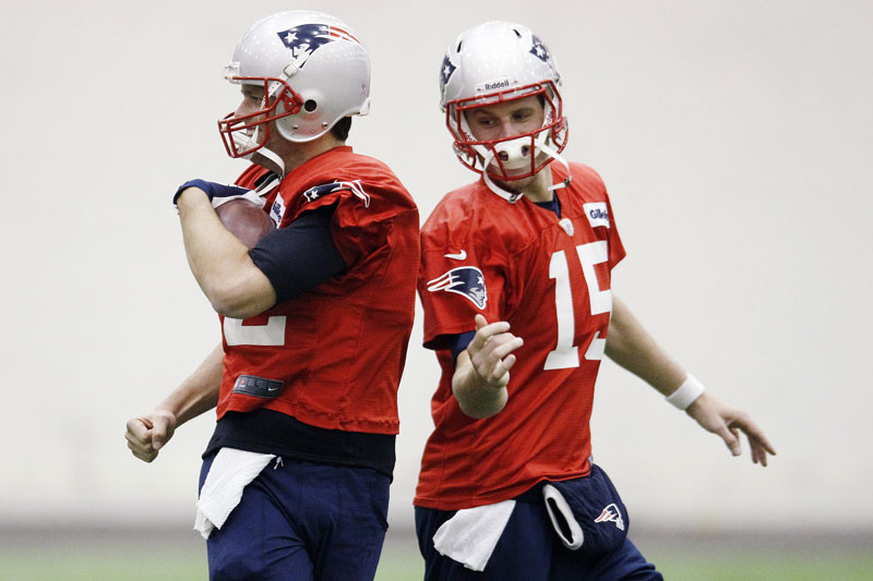 BACK TO WORK: New England Patriots quarterbacks Tom Brady, left, and Ryan Mallett) participate in a ball handling drill during practice Wednesday in Foxborough, Mass. The Patriots return from their bye to face the Buffalo BIlls on Sunday.