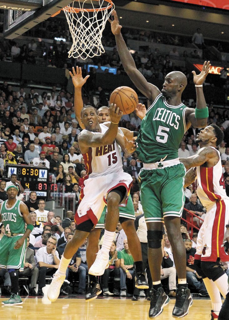 DEFEND: Kevin Garnett, right, and the Boston Celtics will try to bounce back from their season-opening loss to the Miami Heat when they host the Milwaukee Bucks tonight. Miami Heat vs. Boston Celtics 1
