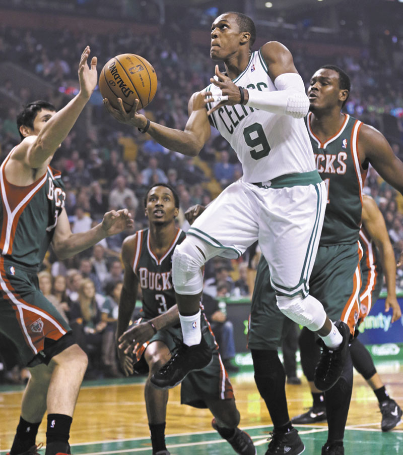 Boston Celtics guard Rajon Rondo drives to the basket against the Milwaukee Bucks in the first quarter of an NBA basketball game in Boston, Friday, Nov. 2, 2012. (AP Photo/Charles Krupa)
