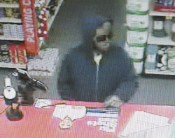 In this surveillance camera still image, the suspect in the Saturday robbery of the Capitol Street CVS pharmacy is shown.