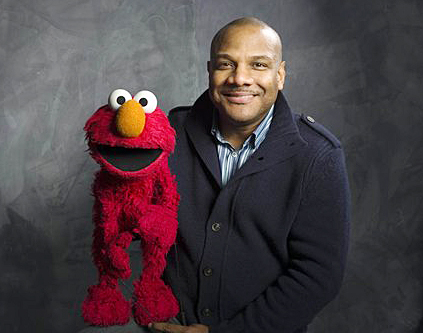 "Sesame Street" puppeteer Kevin Clash poses with Elmo in this 2011 photo.