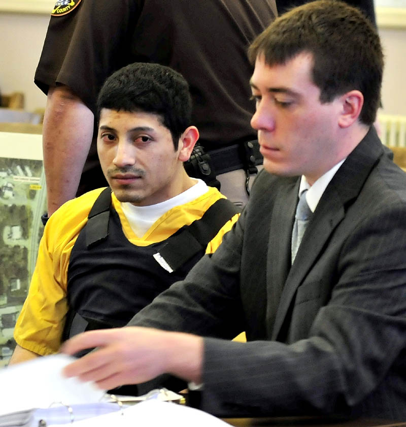 Defendant Juan Contreras sits with attorney Chris Berryment on Monday in Franklin County Superior Court in Farmington during the first day of Contreras’ trial in the stabbing death of Grace Burton.