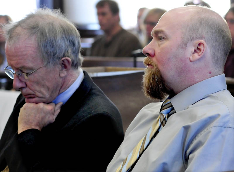 Murder defendant Robert Nelson, right, listens to opening statements in his trial in the death of Everett Cameron on Monday in Somerset County Superior Court in Skowhegan. At left is attorney John Alsop.