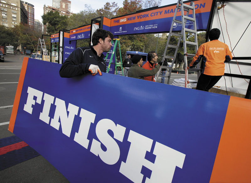 Workers assemble the finish line for the New York City Marathon in New York's Central Park, Thursday, Nov. 1, 2012. The 43rd New York City Marathon is on Sunday, with many logistical questions to be answered.