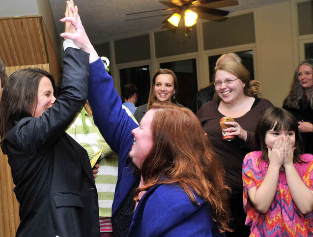 Staff photo by David Leaming LOCAL WINNERS: District Attorney candidate Maeghan Maloney, left, and Senate District 25 candidate Colleen Lachowicz react with joy after it was announced they beat their respective opponents in Waterville on Tuesday.
