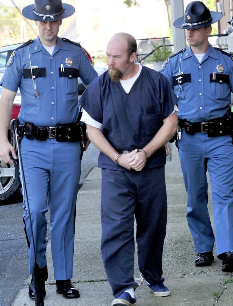 Robert Nelson is led out of Somerset County Superior Court in Skowhegan on Oct. 6, 2011, following a hearing in the shooting death of Everett Cameron.
