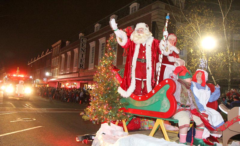 Santa and Mrs. Claus arrive in downtown Waterville during the 7th annual Parade of Lights on Friday night. The parade culminated with the lighting of the giant spruce tree in Castonguay Square and the opening of Kringleville.