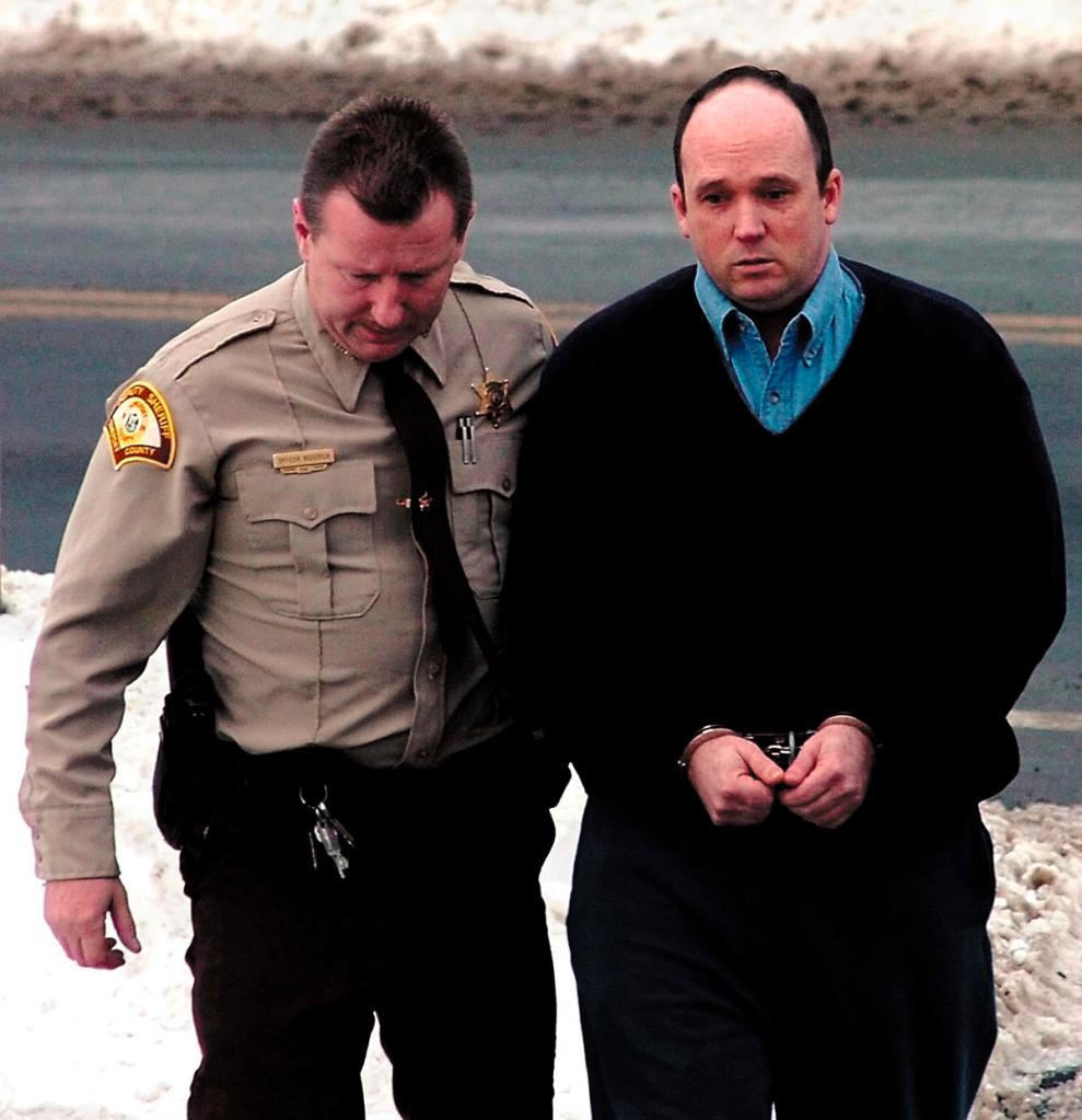 Todd Curry is led into Somerset Superior Court in Skowhegan on March 18, 2010.