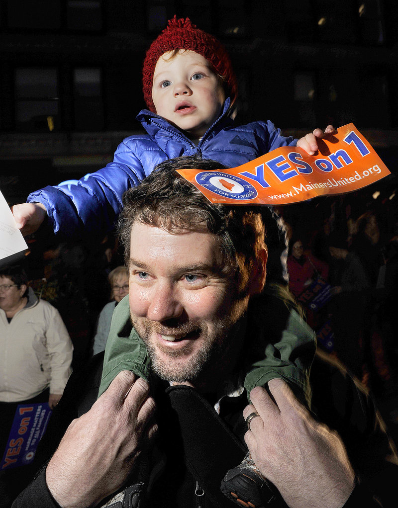Attendees at a same-sex marriage rally Thursday night in Portland’s Monument Square included Matt Pines, who brought his son, Tanner, 18 months.