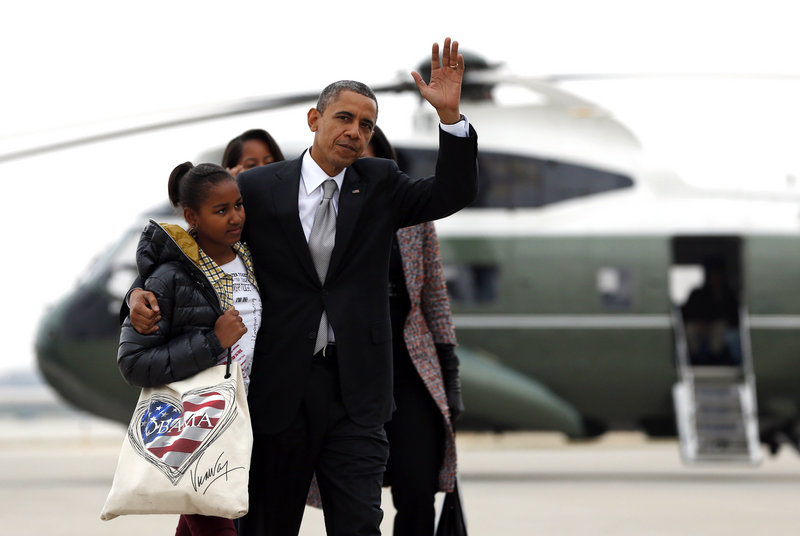 President Barack Obama and daughter Sasha prepare to board Air Force One Wednesday for the trip back to Washington from Chicago.