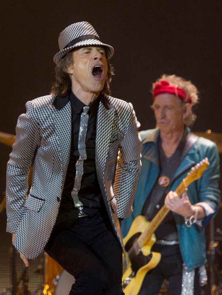 Mick Jagger, left, and Keith Richards of The Rolling Stones perform Sunday at the O2 Arena in London. The Stones are celebrating their 50th anniversary.