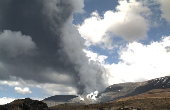 In this photo released by the Institute of Geological and Nuclear Sciences smoke billows out of Te Maari crater on Mount Tongariro, New Zealand, after a brief eruption Wednesday.