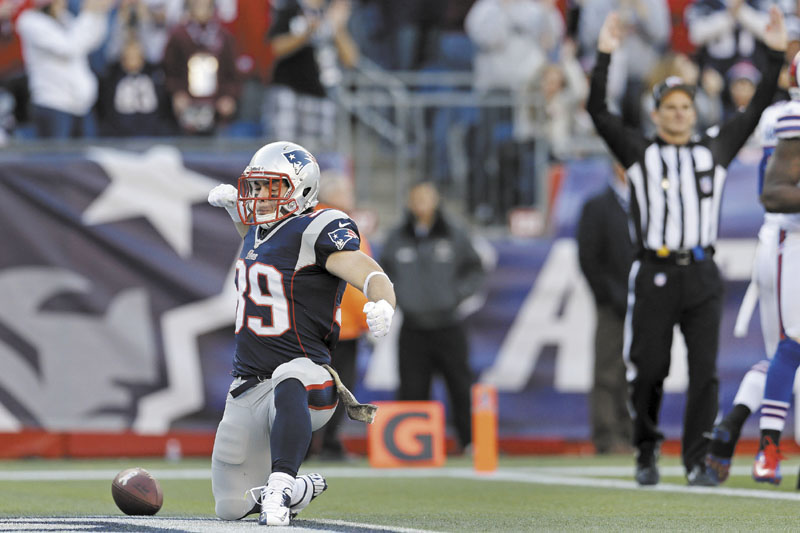 BOOM: New England Patriots running back Danny Woodhead celebrates his touchdown in the third quarter of the Patriots’ 37-31 win over the Buffalo Bills on Sunday at Gillette Stadium in Foxborough, Mass. NFLACTION12; Gillette Stadium