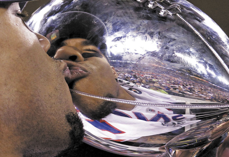 SUPER BOWL CHAMPS: New York Giants wide receiver Devin Thomas kisses the Vince Lombardi Trophy after his team's 21-17 win over the New England Patriots in Super Bowl XLVI last February.