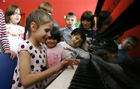 Orphan children play music at an orphanage in the southern Russian city of Rostov-on-Don on Wednesday.