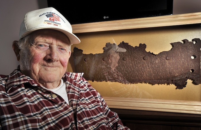 Bert Davis, a veteran who lived through the attack on Pearl Harbor, is pictured with a piece of steel from the USS Arizona ,which will be unveiled at a ceremony on Friday, at a ceremony at the Maine Veterans Home in South Paris.