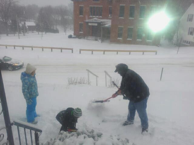From right, Derek Nickerson, his son, Timmy, and daughter, Macy, get to work clearing the snow in Gardiner on Thursday.
