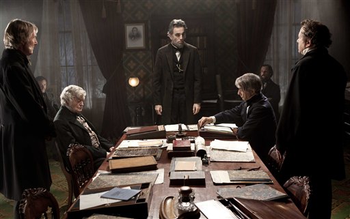 FILE - This undated publicity photo released by DreamWorks and Twentieth Century Fox shows, Daniel Day-Lewis, center rear, as Abraham Lincoln, in a scene from the film, "Lincoln." The film was nominated for a Golden Globe for best drama on Thursday, Dec. 13, 2012. Daniel Day Lewis was also nominated for best actor. The 70th annual Golden Globe Awards will be held on Jan. 13. (AP Photo/DreamWorks, Twentieth Century Fox, David James, File) Daniel Day-Lewis;David Strathairn;Hal Holbrook;Joseph Cross;Jeremy Strong;David Costabile;Byron Jennings