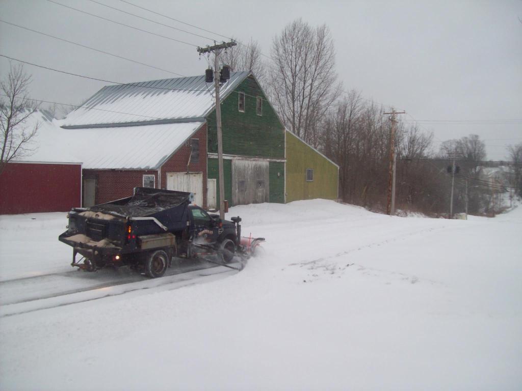A Skowhegan highway department truck clears Hathaway Street on Thursday.