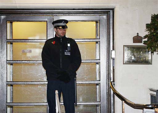 A policeman stands guard outside the King Edward VII hospital, in central London on Friday.