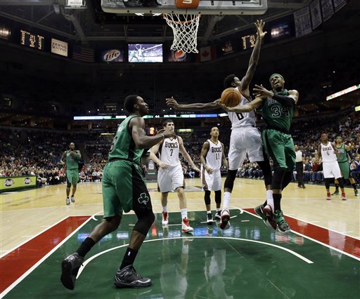 Boston Celtics' Paul Pierce (34) tries to drive to the basket past Milwaukee Bucks' Larry Sanders (8) during the first half of an NBA basketball game on Saturday, Dec. 1, 2012, in Milwaukee.