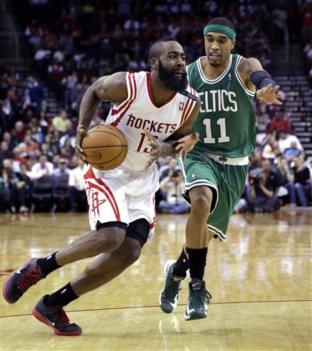 Houston Rockets' James Harden (13) drives to the basket as Boston Celtics' Courtney Lee (11) defends during the third quarter of an NBA basketball game Friday in Houston. The Rockets beat the Celtics 101-89.