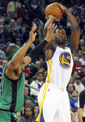 Golden State Warriors' Harrison Barnes (40) shoots as Boston Celtics' Paul Pierce guards during the second half of an NBA basketball game in Oakland, Calif., Saturday, Dec. 29, 2012. (AP Photo/George Nikitin) ORACLE Arena