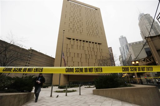 Police tape surrounds Chicago's Metropolitan Correctional Center, where Banks and Conley somehow broke a large hole into the bottom of a 6-inch wide window, dropped a makeshift rope made of bed sheets out and climbed down about 20 stories to the ground.