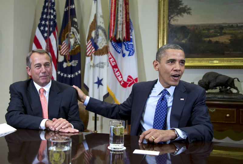 President Obama acknowledges House Speaker John Boehner of Ohio while speaking to reporters in the Roosevelt Room of the White House in Washington on Nov. 16. Administration officials say Obama and Boehner met Sunday at the White House to discuss the ongoing negotiations over the impeding "fiscal cliff."