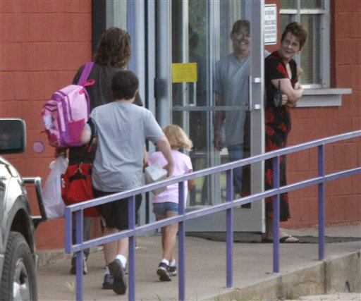 Students arrive for the first day of classes at the Harrold Independent School District in Harrold, Texas, in this 2008 file photo. The school has a policy allowing teachers and other employees to carry concealed weapons on campus. Some lawmakers in at least five other states are looking into similar legislation. Anti-gun groups oppose the measure.